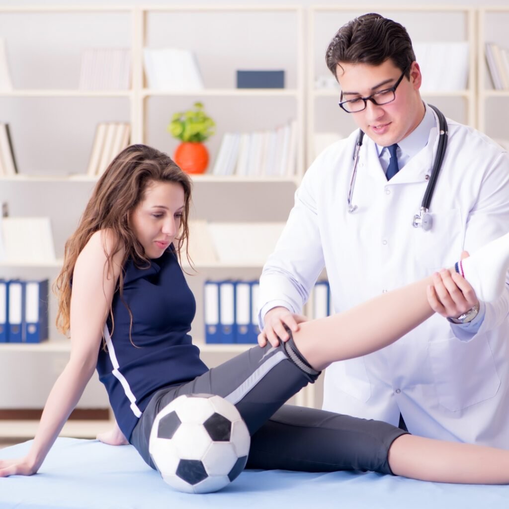 physiotherapist helping patient, sports injury rehabilitation